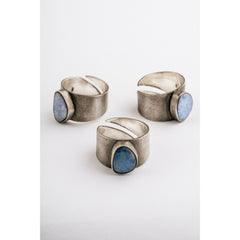 Group of Oxidized Opal Doublet Adjustable Rings shown on white background with wide textured sterling silver bands.