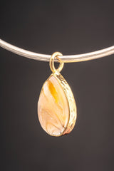 Golden Seashell Ocean Talisman Pendant displayed on a choker with natural shell and warm gold-plated setting.