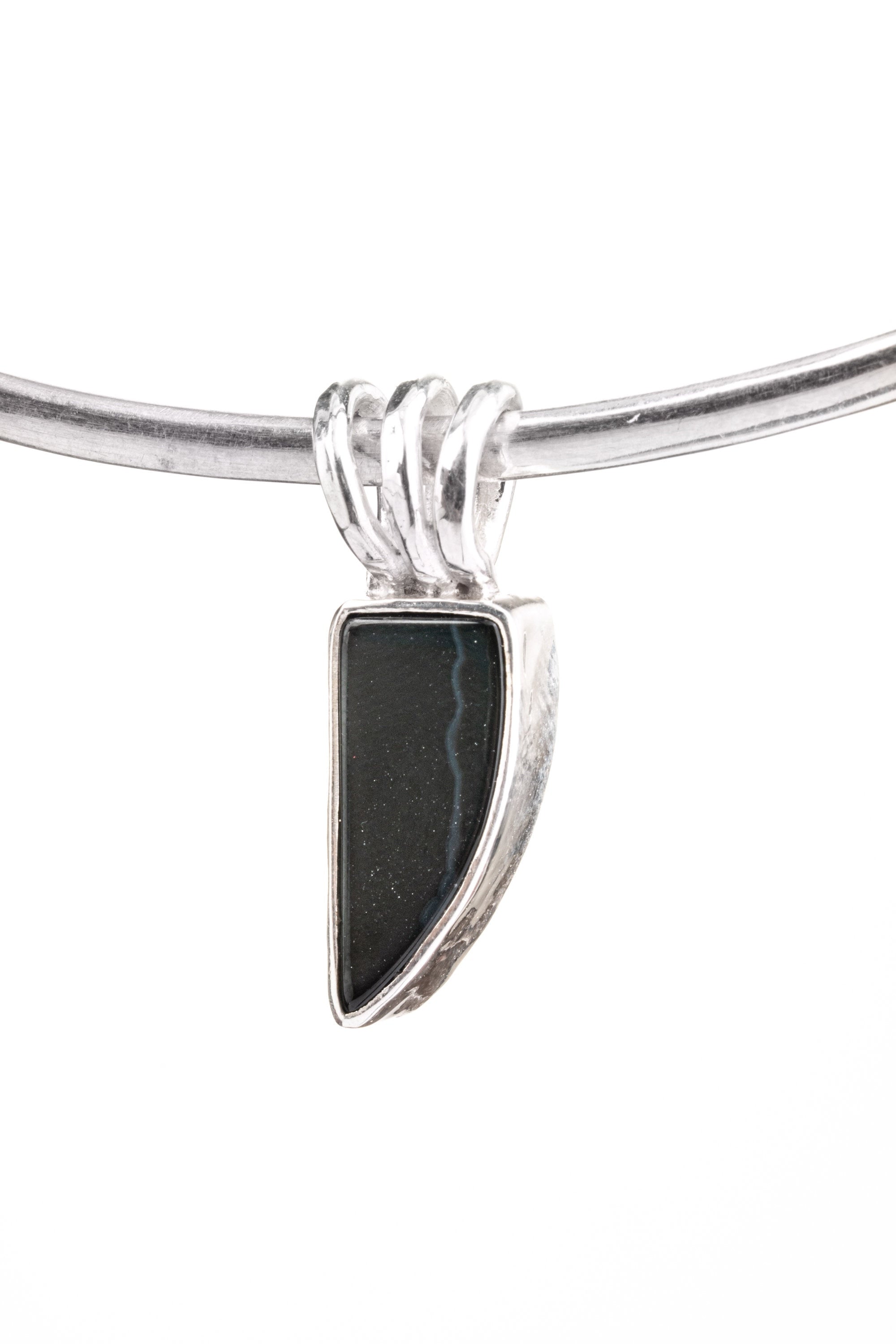 Minimal Black Onyx pendant in 925 sterling silver shown on an adjustable cord with clean black stone setting.