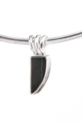 Minimal Black Onyx pendant in 925 sterling silver shown on an adjustable cord with clean black stone setting.