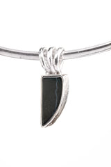 Minimal Black Onyx pendant in 925 sterling silver shown on an adjustable cord with clean black stone setting.