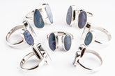 Australian Opal Doublet Adjustable Ring shown on white background with two luminous Opals and sterling silver open band.