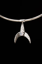 Crescent Whale Moonstone pendant displayed on black background with oxidized sterling silver and blue Moonstone accent.