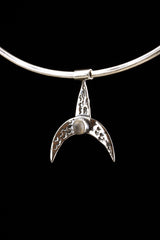 Blue Moonstone crescent whale pendant displayed on a choker with textured oxidized sterling silver finish.