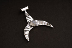 Crescent Whale Moonstone pendant shown on dark background with oxidized sterling silver and Blue Moonstone accent.