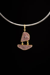 Double raw Indian Ruby pendant with mica inclusions and 16k gold-plated sterling silver setting, shown on a black cord.