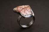 Handmade 925 sterling silver Rhodochrosite ring shown on a dark background, with pink rose stone and sturdy silver band.
