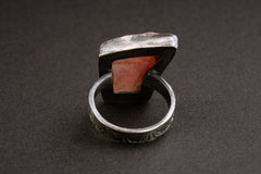 Back view of Rhodochrosite sterling silver ring showing the circular band shape and raised handmade stone setting.