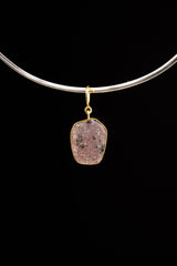 Raw Indian Ruby pendant shown beside a ruler for scale, measuring approximately 3 to 3.5 cm total length including bail.