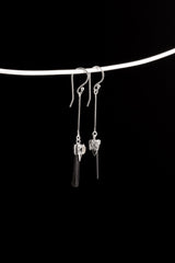 Tourmaline Herkimer Diamond dangle earrings displayed on a silver choker, showing slim sterling silver construction.