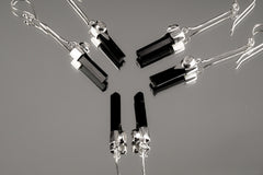 Tourmaline Herkimer Diamond earrings shown as a small collection, with sterling silver hooks and long crystal drops.