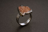 Handmade 925 sterling silver Rhodochrosite ring shown on a dark background, with rose mineral stone and sturdy silver band.