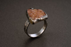 Handmade 925 sterling silver Rhodochrosite ring shown on a dark background, with rose mineral stone and sturdy silver band.