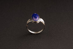 Front view of Lapis Lazuli oxidized silver ring showing deep blue stone and rugged hammered sterling silver band.