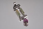 Aquamarine Tourmaline Amethyst statement pendant shown on a white background with oxidized sterling silver and hinged gemstone layout.