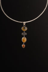 Ethiopian Opal Tourmaline Smoky Quartz Agate pendant shown worn on a silver choker with long hinged gemstone design.