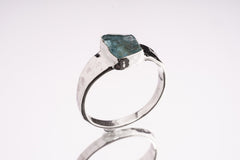 Blue Apatite Textured Silver Ring shown from the side with hand-textured sterling silver band and raised blue stone.