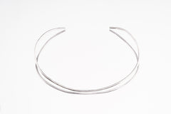 Sterling silver open collar choker shown in high-shine silver finish as an alternate minimal necklace option.