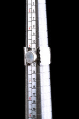 Blue Moonstone Hammered Silver Ring shown beside a ruler for size reference with wide hammered sterling silver band.