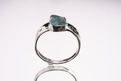 Blue Apatite Textured Silver Ring shown on white background with natural blue gemstone and sterling silver bezel setting.