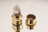 Rutilated Quartz gold-plated brass capsule pendant shown open with stone-topped lid and hidden storage space.