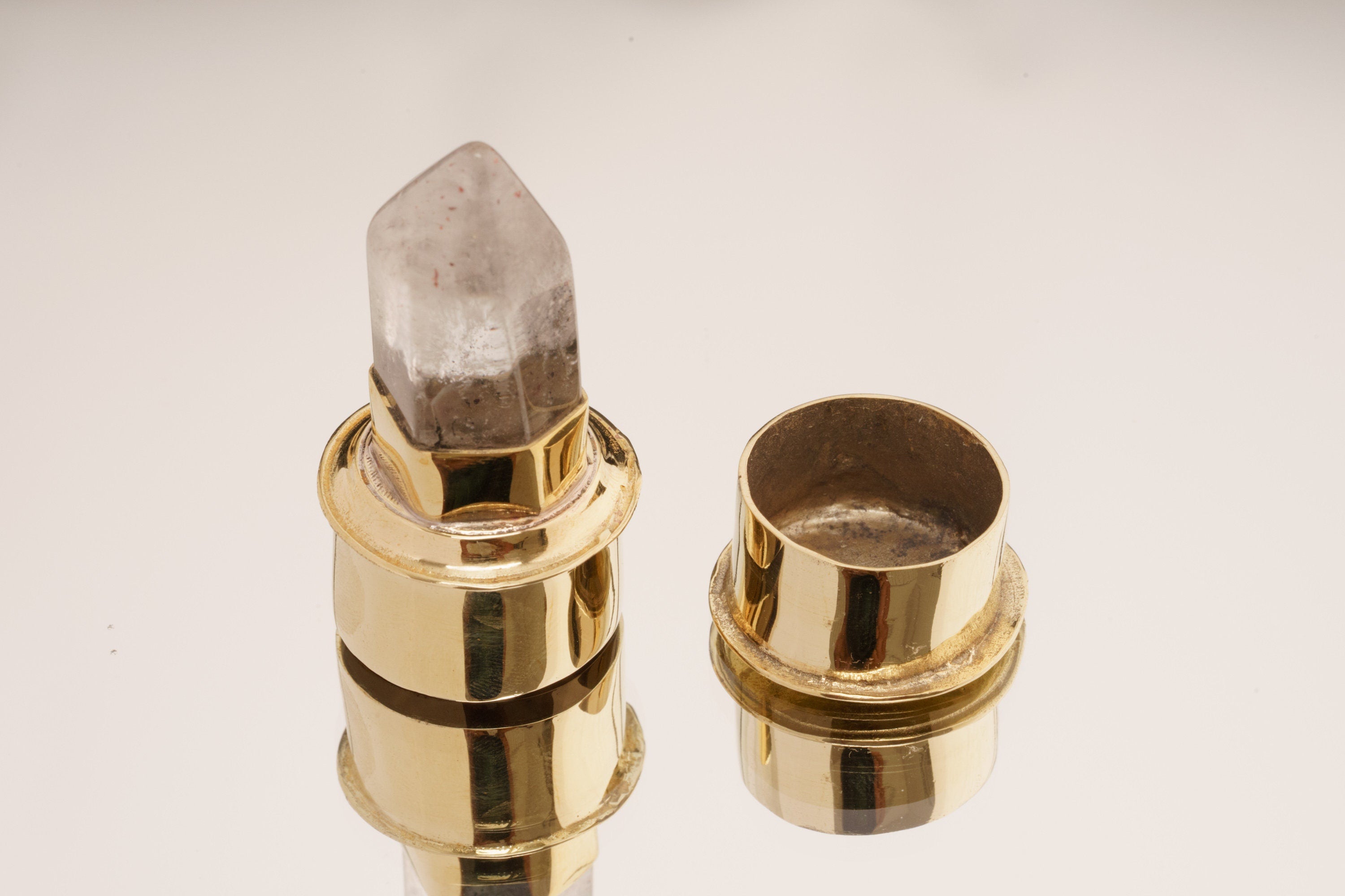 Rutilated Quartz gold-plated brass capsule pendant shown open with stone-topped lid and hidden storage space.
