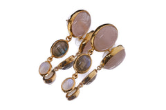 Close view of Rose Quartz, Moonstone, and Labradorite earrings showing warm gold-plated settings and soft crystal colours.