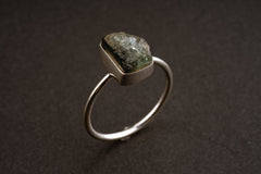 Side view of handmade Blue Tourmaline ring showing the raised deep blue stone and solid sterling silver band.