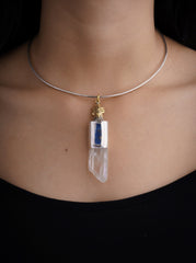 Himalayan Twin Quartz Kyanite Rooster pendant shown worn on the chest with brushed sterling silver and brass detail.