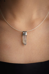 Himalayan Black Rutile Quartz Stack Pendant shown worn on the chest as a slim sterling silver layering necklace.