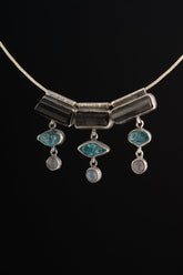 Grounding Vision Stack Pendant with Black Tourmaline, Blue Apatite, and Labradorite in oxidized sterling silver, shown on black cord.