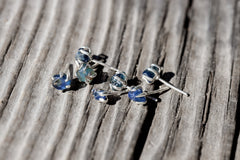 Group of Australian Sapphire stud earrings showing natural creek tumbled stones in 925 sterling silver claw settings.