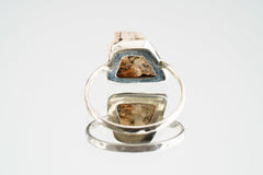 Back view of Sunstone sterling silver ring showing the circular band shape and raised handmade gemstone setting.
