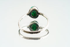 Back view of handmade sterling silver Emerald ring showing the circular band shape and raised gemstone setting.