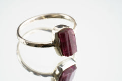 Pink Tourmaline sterling silver ring shown on a light background, with a rose gemstone and handmade silver setting.