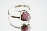 Handmade 925 sterling silver Pink Tourmaline ring shown worn on the hand, with raw rose gemstone and sturdy silver band.