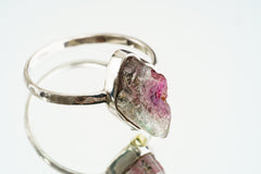 Side view of Watermelon Tourmaline ring showing the raised raw pink green stone and sturdy handmade sterling silver band.