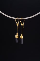Black Tourmaline dangle earrings in gold-plated 925 sterling silver displayed on a silver choker with dark crystal drops.