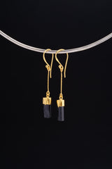 Black Tourmaline dangle earrings in gold-plated 925 sterling silver displayed on a silver choker with dark crystal drops.