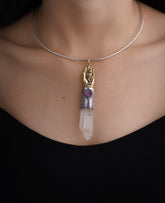 Sun Wukong Buddha Hand Clear Quartz Amethyst pendant shown worn on a black necklace with sterling silver talisman setting.