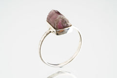 Side view of Pink Tourmaline silver ring showing the raised deep rose stone and sturdy handmade sterling silver band.