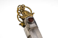 Close-up of Carnelian and Clear Quartz in a sterling silver symbolic pendant inspired by the Buddha’s raft parable.