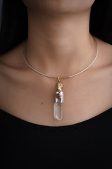 Rooster Carnelian Clear Quartz pendant shown worn on the chest with handmade talisman setting and adjustable black cotton necklace.
