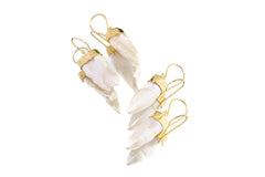 Handmade Pearl earrings shown on a white background, featuring elongated natural Pearls and polished sterling silver.