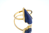 Lapis Lazuli Gold Plated Silver Ring shown on white background with deep blue stone and sculptural gold plated band.