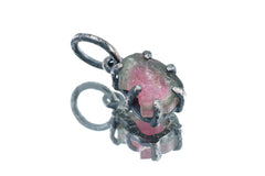 Watermelon Tourmaline pendant on white background showing handmade oxidized silver claw frame and raw crystal detail.