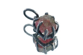 Watermelon Tourmaline Claw Pendant on white background with oxidized sterling silver and natural pink-green crystal.