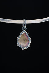 Watermelon Tourmaline Claw Pendant shown worn on a silver choker with small oxidized silver setting.