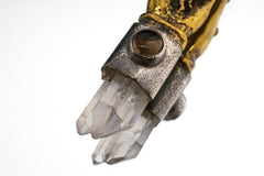 Close-up of Clear Quartz and Smoky Quartz in a symbolic talisman pendant.
