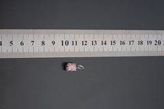Watermelon Tourmaline pendant shown beside ruler for scale 2cm with pink-green crystal in oxidized silver claw setting.